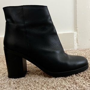Black leather heeled boots from Topshop in size 9.